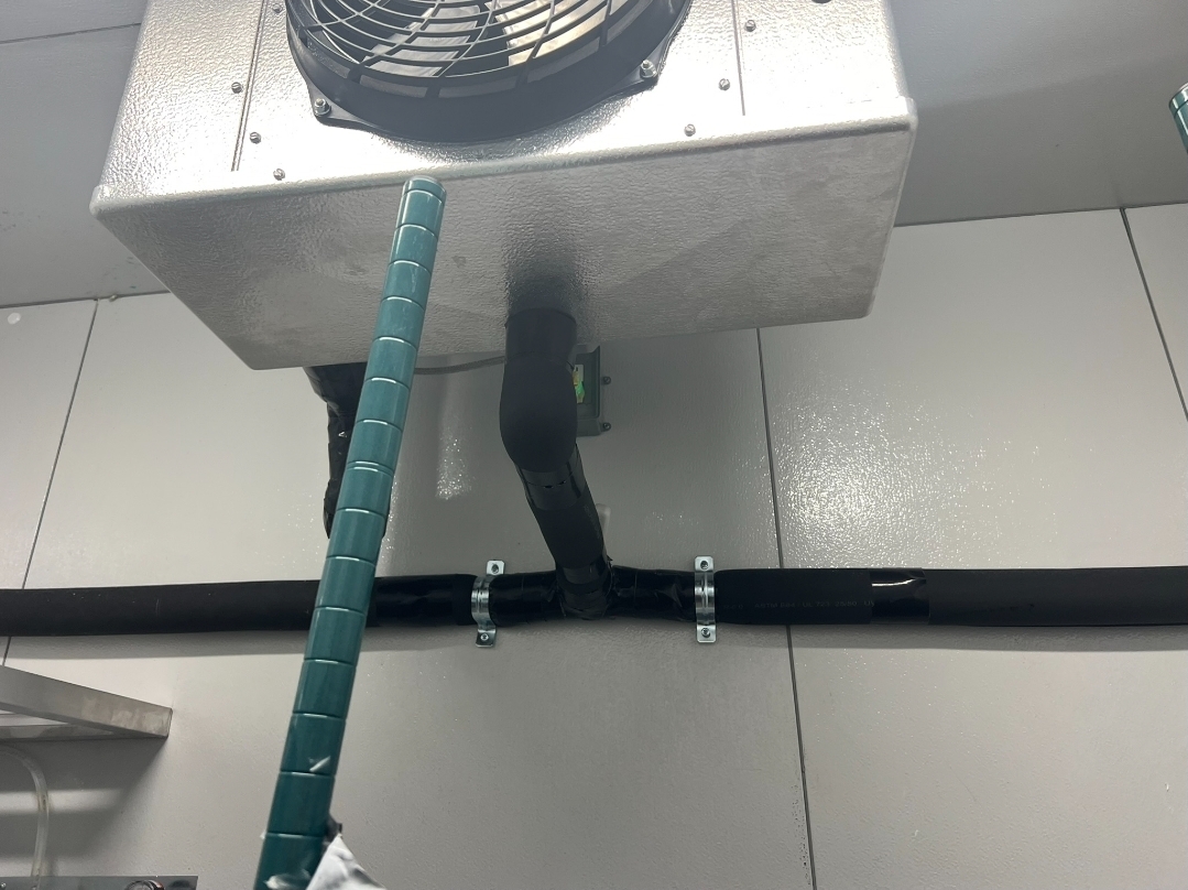 Ceiling evaporator unit with significant ice buildup and icicles