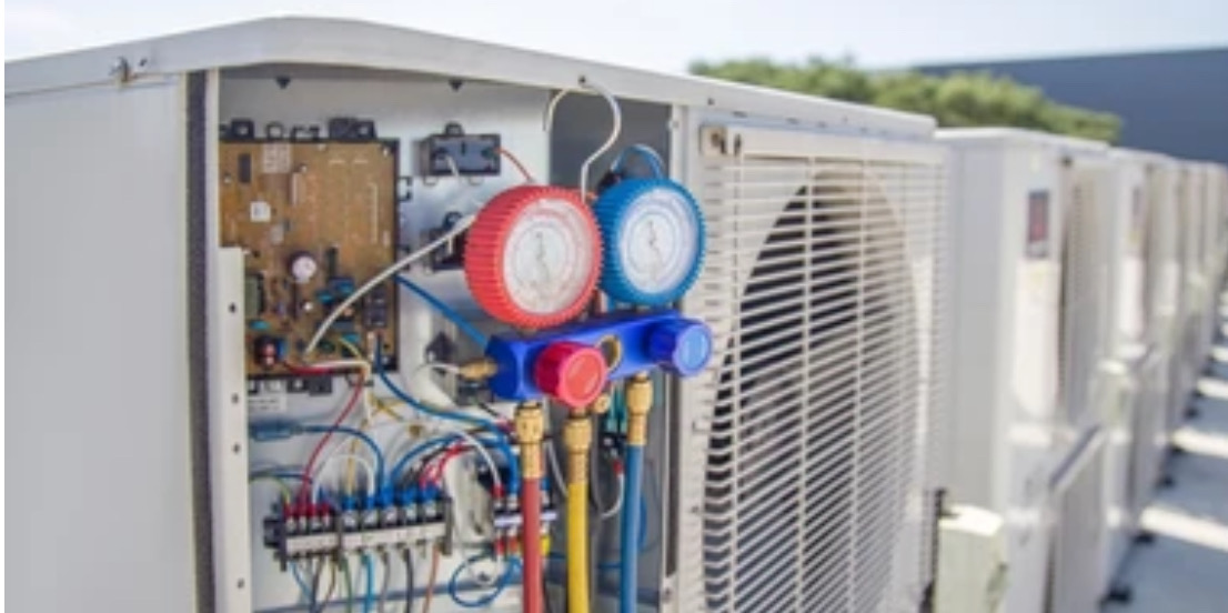 Professional HVAC diagnostic work with pressure gauges and testing equipment