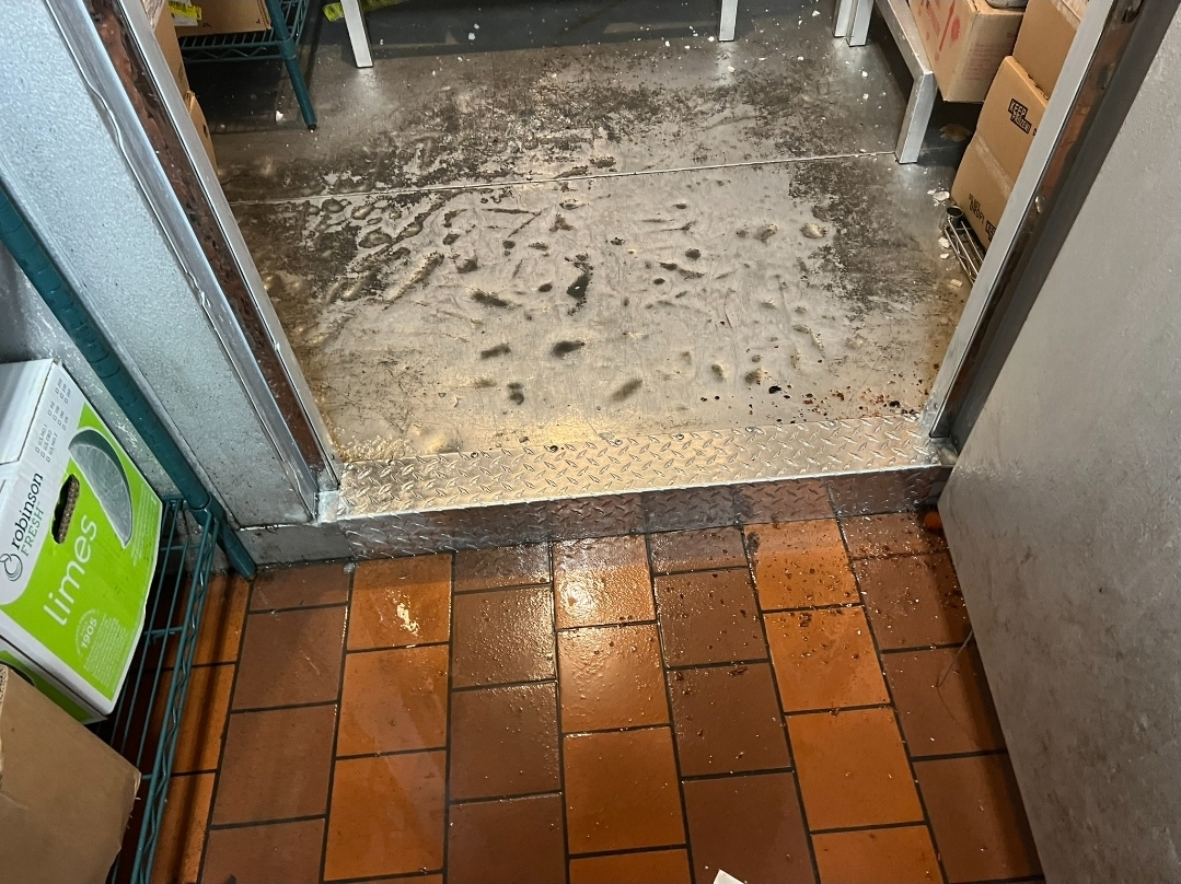 Walk-in cooler floor damage assessment and repair needs